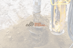 Skid Steer Vibratory Post Driver vs. Drop Hammer Mechanics for Rocky Soil 