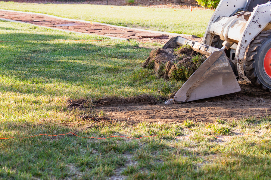 grade a yard with a skid steer